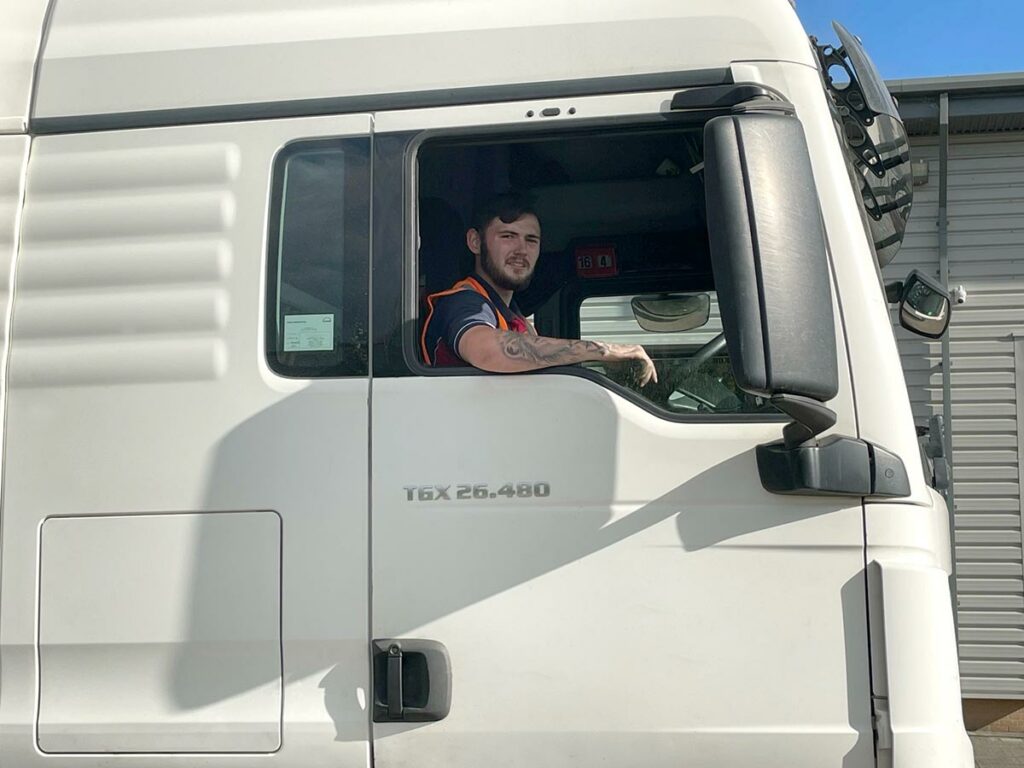 GS Couriers Truck Driver in cab