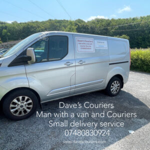 A photograph of a silver van with the writing 'Daves Couriers' on the side