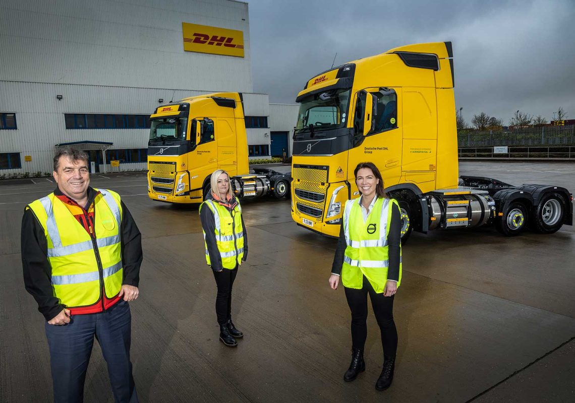 DHL staff with Volvo Bio-LNG Trucks