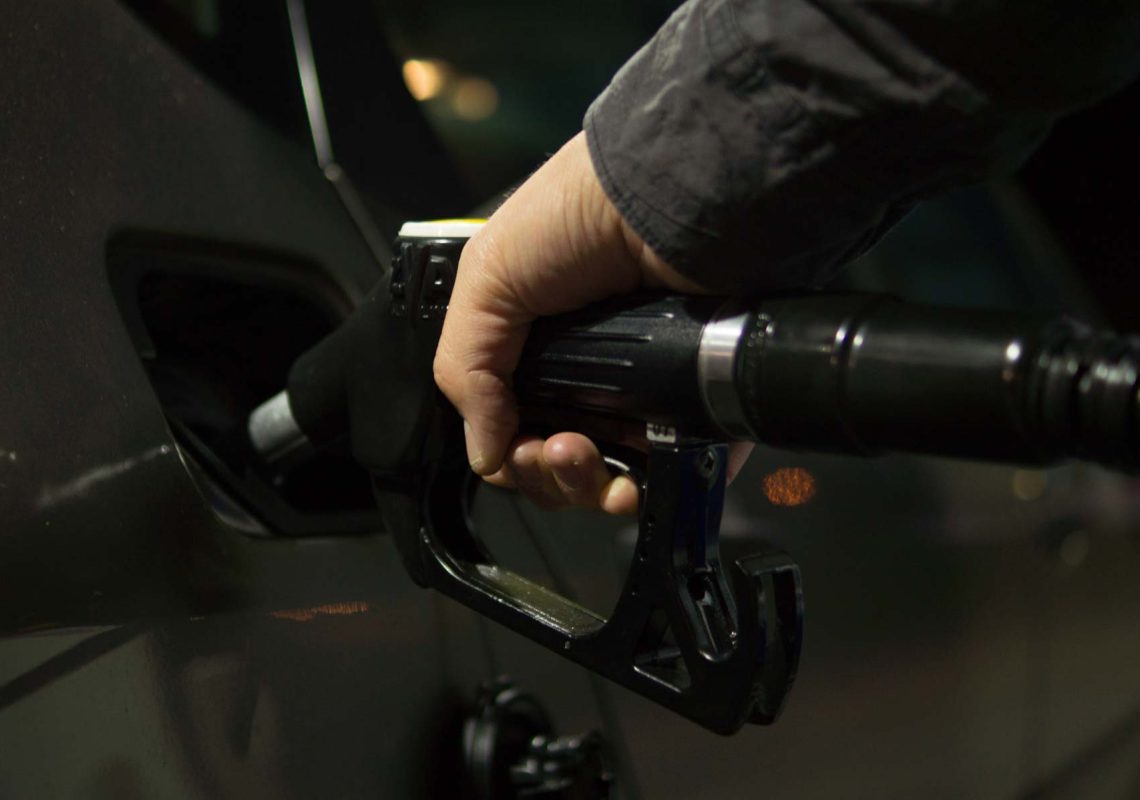fuel nozzle filling up vehicle with diesel